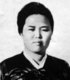 Kim Jong-suk was born December 24, 1917 to Kim Chun San and Oh Ssi, who were poor farmers in Osan-dong, Hoeryong County, in the North Hamgyong Province of Japanese-occupied Korea. In 1922 her family abandoned Korea to live in China. Kim Jong-suk joined the Young Communist League of Korea, led by Kim Il-sung, on July 10, 1932.<br/><br/>

Later, on April 25, 1936, she was assigned to the KPRA main unit directly under the command of Kim Il-sung. Kim Jong-suk was formally admitted into the Communist Party on January 25, 1937. Kim Jong-suk gave birth to Kim Jong-il on February 16, 1941 in the Soviet village of Vyatskoye, near Khabarovsk.<br/><br/>

On September 22, 1949, Kim Jong-suk died at the age of 31 while giving birth to a stillborn baby girl. Known in North Korea as 'The Heroine of the Anti-Japanese Revolution', the North Korean government conferred the title of Hero of the DPRK on her on September 21, 1972; her image is used as part of the propaganda apparatus of the Workers Party of Korea (WPK), in which she is portrayed as a revolutionary woman. She is credited as the founder of the WPK's auxiliary organizations, the Korean Children's Union and the Korean Democratic Women's Union, among others.
