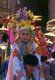 Thailand: A 'Crystal Son' sits atop a relatives shoulders and awaits his final ordination at Wat Phra Singh, Poy Sang Long Festival, Chiang Mai. northern Thailand